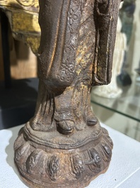 A Chinese cast iron sculpture of a Luohan, probably Ming
