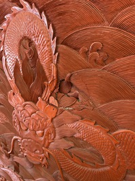 A Chinese five-piece red lacquer throne ensemble with dragons in imperial Qianlong style, 20th C.