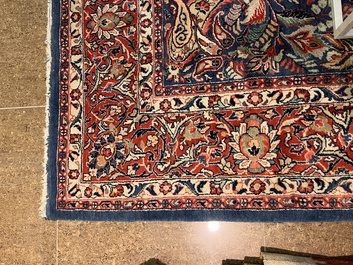 A Persian Sarouk rug with central medallion and floral design, wool on cotton, 20th C.