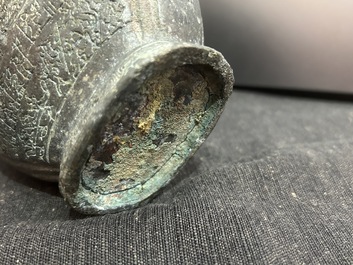 A Chinese bronze 'bianhu' vase and a 'zhong' bell, possibly Han and Western Zhou Dynasty