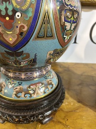 A pair of Chinese cloisonn&eacute; 'taotie masks' vases, 20th C.