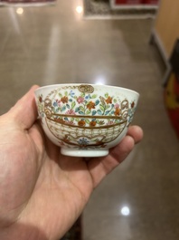 A Chinese famille rose 'flower basket' cup and saucer, Qianlong