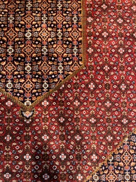 A Persian Bidjar rug with floral design, wool on cotton, 20th C.