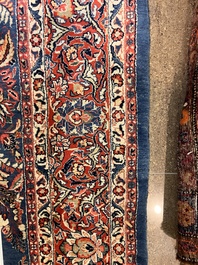 A Persian Sarouk rug with central medallion and floral design, wool on cotton, 20th C.