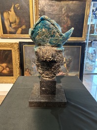 A large Chinese partly turquoise-glazed pottery head of Guanyin in Ming style, probably 19th C.