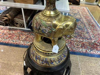 A reticulated Chinese wooden stand with marble top and a French gilt brass and champlev&eacute; 'elephant' lamp, 20th C.