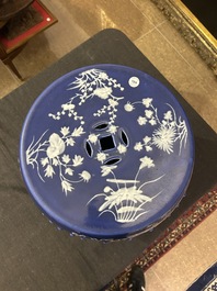 A Chinese white-slip-decorated blue-ground garden seat and two jardini&egrave;res, 19th C.