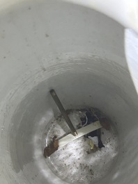 A pair of Chinese famille rose vases and a tall blue and white vase, 19th/20th C.