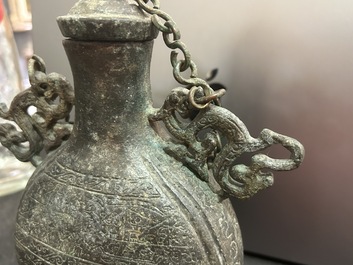 A Chinese bronze 'bianhu' vase and a 'zhong' bell, possibly Han and Western Zhou Dynasty