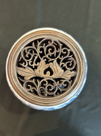 A Chinese blue and white jar with reticulated wooden cover, Kangxi