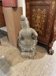 Een Chinese stenen figuur van Boeddha op een rots, Qing