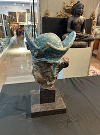 A large Chinese partly turquoise-glazed pottery head of Guanyin in Ming style, probably 19th C.