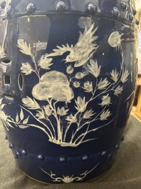 A Chinese white-slip-decorated blue-ground garden seat and two jardini&egrave;res, 19th C.