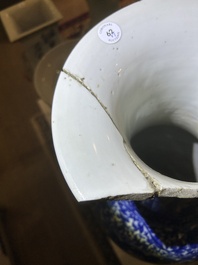 A pair of Chinese famille rose vases and a tall blue and white vase, 19th/20th C.