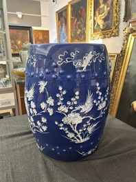 A Chinese white-slip-decorated blue-ground garden seat and two jardini&egrave;res, 19th C.