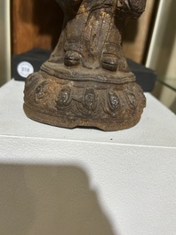 A Chinese cast iron sculpture of a Luohan, probably Ming