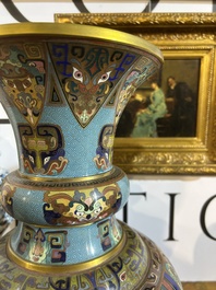 A pair of Chinese cloisonn&eacute; 'taotie masks' vases, 20th C.