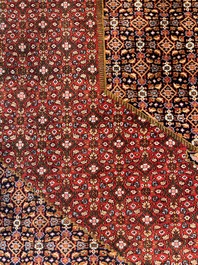 A Persian Bidjar rug with floral design, wool on cotton, 20th C.