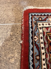 A Persian Bidjar rug with floral design, wool on cotton, 20th C.