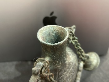 A Chinese bronze 'bianhu' vase and a 'zhong' bell, possibly Han and Western Zhou Dynasty