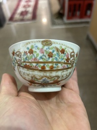 A Chinese famille rose 'flower basket' cup and saucer, Qianlong