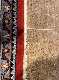 A Persian Bidjar rug with floral design, wool on cotton, 20th C.