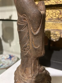 A Chinese cast iron sculpture of a Luohan, probably Ming