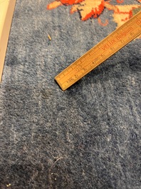 A Persian Sarouk rug with central medallion and floral design, wool on cotton, 20th C.