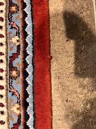 A Persian Bidjar rug with floral design, wool on cotton, 20th C.