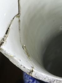 A pair of Chinese famille rose vases and a tall blue and white vase, 19th/20th C.