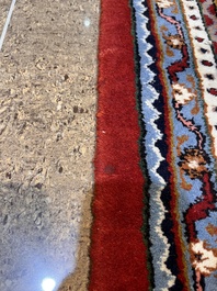 A Persian Bidjar rug with floral design, wool on cotton, 20th C.