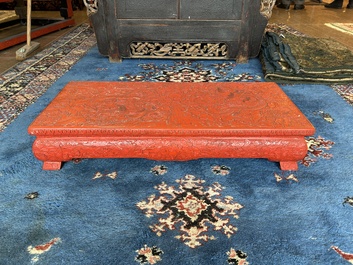 A Chinese five-piece red lacquer throne ensemble with dragons in imperial Qianlong style, 20th C.