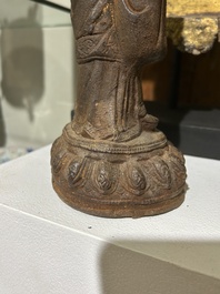 A Chinese cast iron sculpture of a Luohan, probably Ming