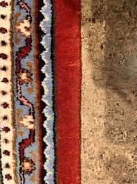 A Persian Bidjar rug with floral design, wool on cotton, 20th C.