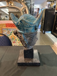 A large Chinese partly turquoise-glazed pottery head of Guanyin in Ming style, probably 19th C.
