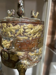 A Chinese parcel-gilt copper tripod 'zun' archaic vessel, probably 17th/18th C.