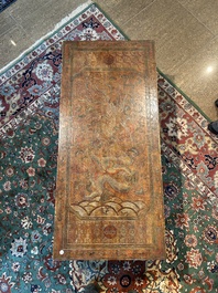 A Chinese low table with partly polychromed wooden top with engraved dragon and phoenix design, Qing and 20th C.