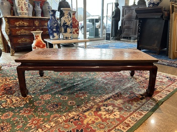A Chinese low table with partly polychromed wooden top with engraved dragon and phoenix design, Qing and 20th C.
