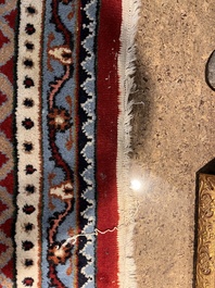 A Persian Bidjar rug with floral design, wool on cotton, 20th C.