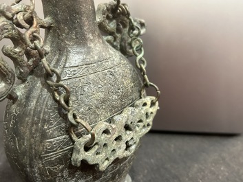 A Chinese bronze 'bianhu' vase and a 'zhong' bell, possibly Han and Western Zhou Dynasty