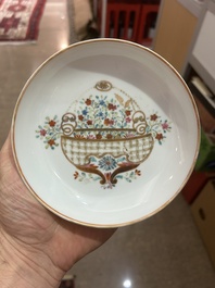 A Chinese famille rose 'flower basket' cup and saucer, Qianlong