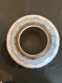 A Chinese blue and white jar with reticulated wooden cover, Kangxi
