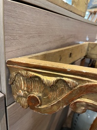 A pair of French carved gilt wooden Louis XV consoles with marble tops, 18th C.