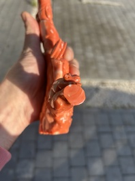 A Chinese red coral group with a scholar, his servant and a monkey, two-character mark, 19th C.