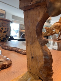 A pair of French carved gilt wooden Louis XV consoles with marble tops, 18th C.