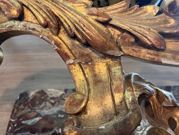 A pair of French carved gilt wooden Louis XV consoles with marble tops, 18th C.