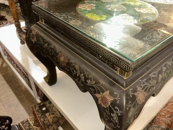 A Chinese rectangular lacquered wooden table with three cloisonn&eacute; plaques, 20th C.