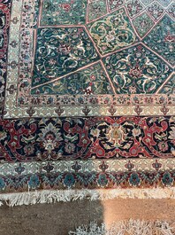 A Persian Tabriz rug with floral design, wool on cotton, first half 20th C.
