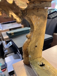 A pair of French carved gilt wooden Louis XV consoles with marble tops, 18th C.