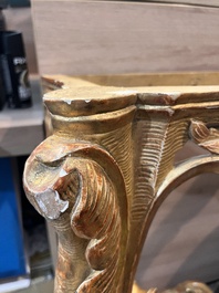 A pair of French carved gilt wooden Louis XV consoles with marble tops, 18th C.